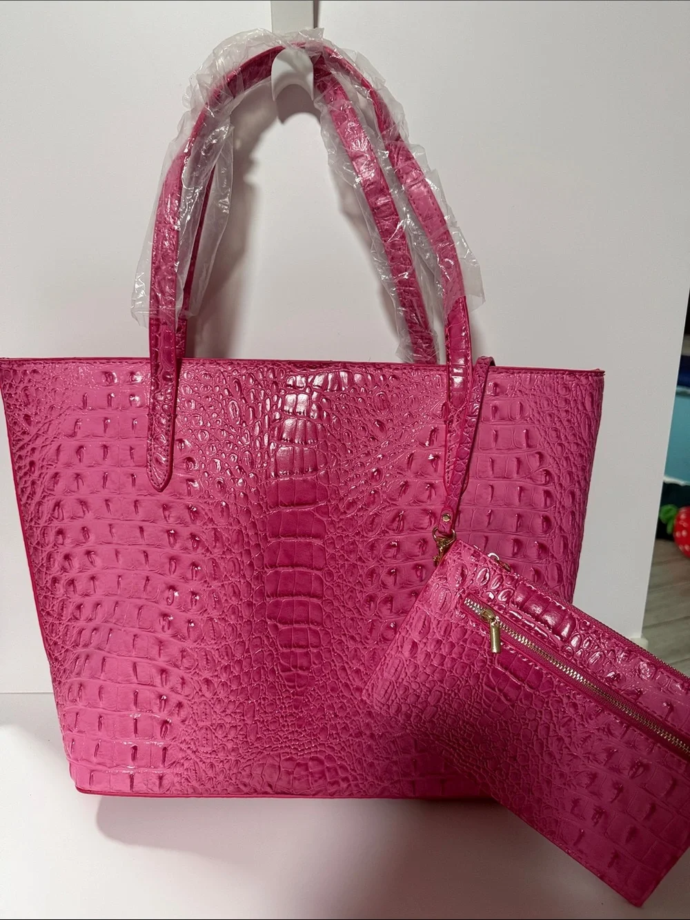 Large hot pink croc embossed tote bag with detachable wristlet